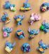 Фигурка-сюрприз в капсуле STITCH серии "Feed Me" - СТИЧ СО ВКУСНЯШКАМИ (в ассорт., в диспл.), комбинированый